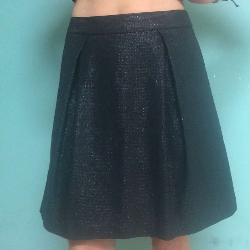 Black midi length skirt with gold sparkles